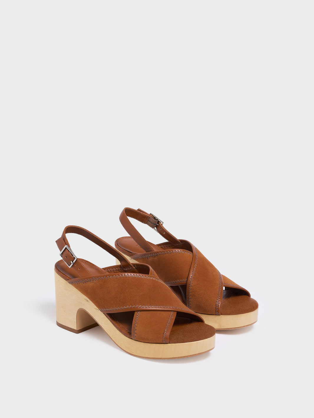 Angle View of a pair of chestnut leather block heel sandals with an adjustable ankle strap design.