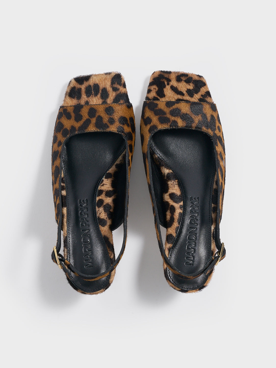 Top view of a pair of leopard hair calf slingback sandals with a flared kitten heel and square toe detail.