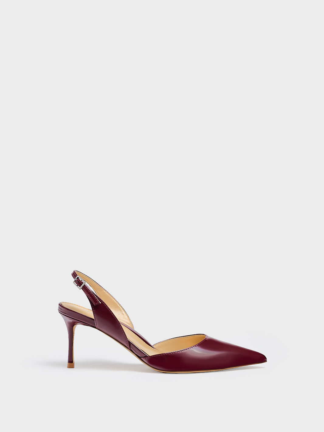 Profile view of a merlot red patent leather slingback heel with a pointed toe.