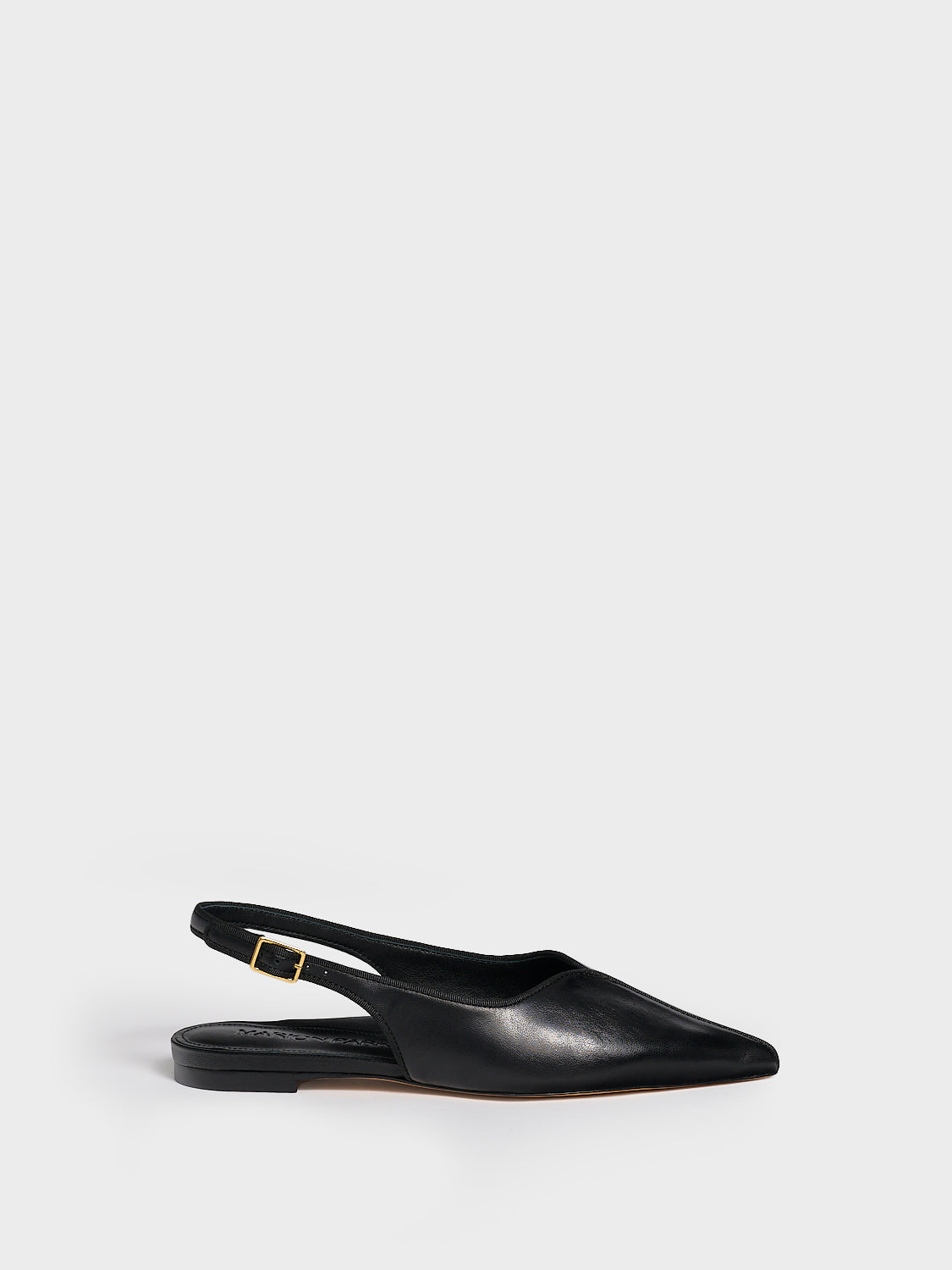 Profile view of a black leather slingback flat with a grosgrain trim detail.