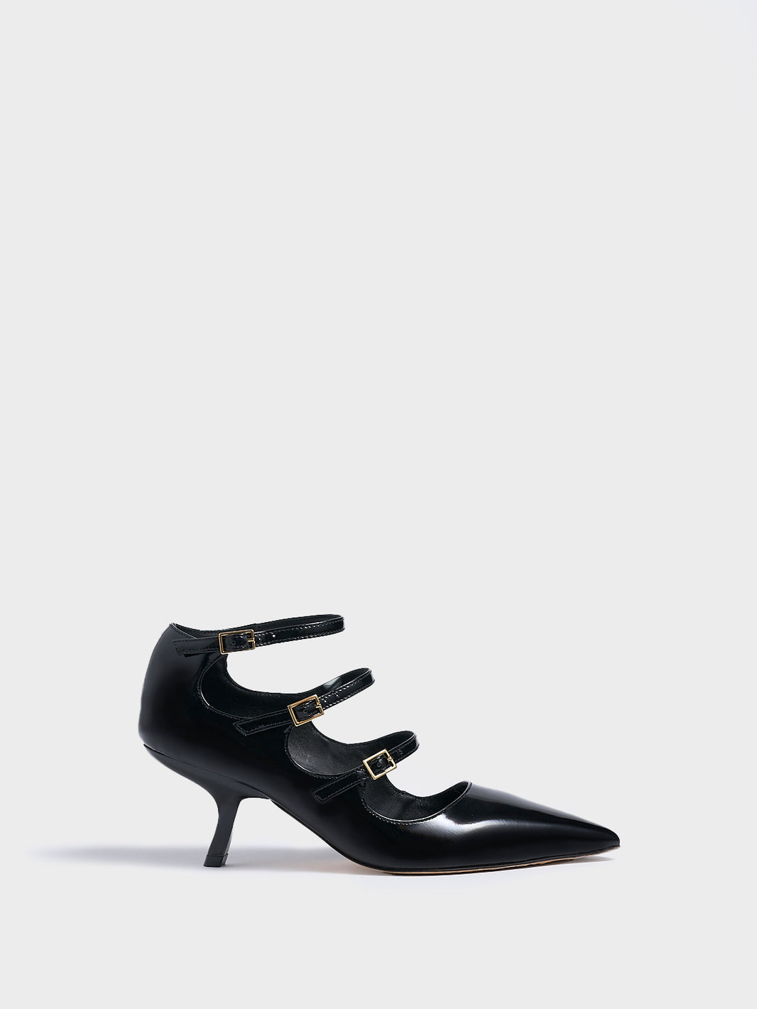 Profile view of a black brushed calf  leather mary jane heels with adjustable straps and a pointed toe. 