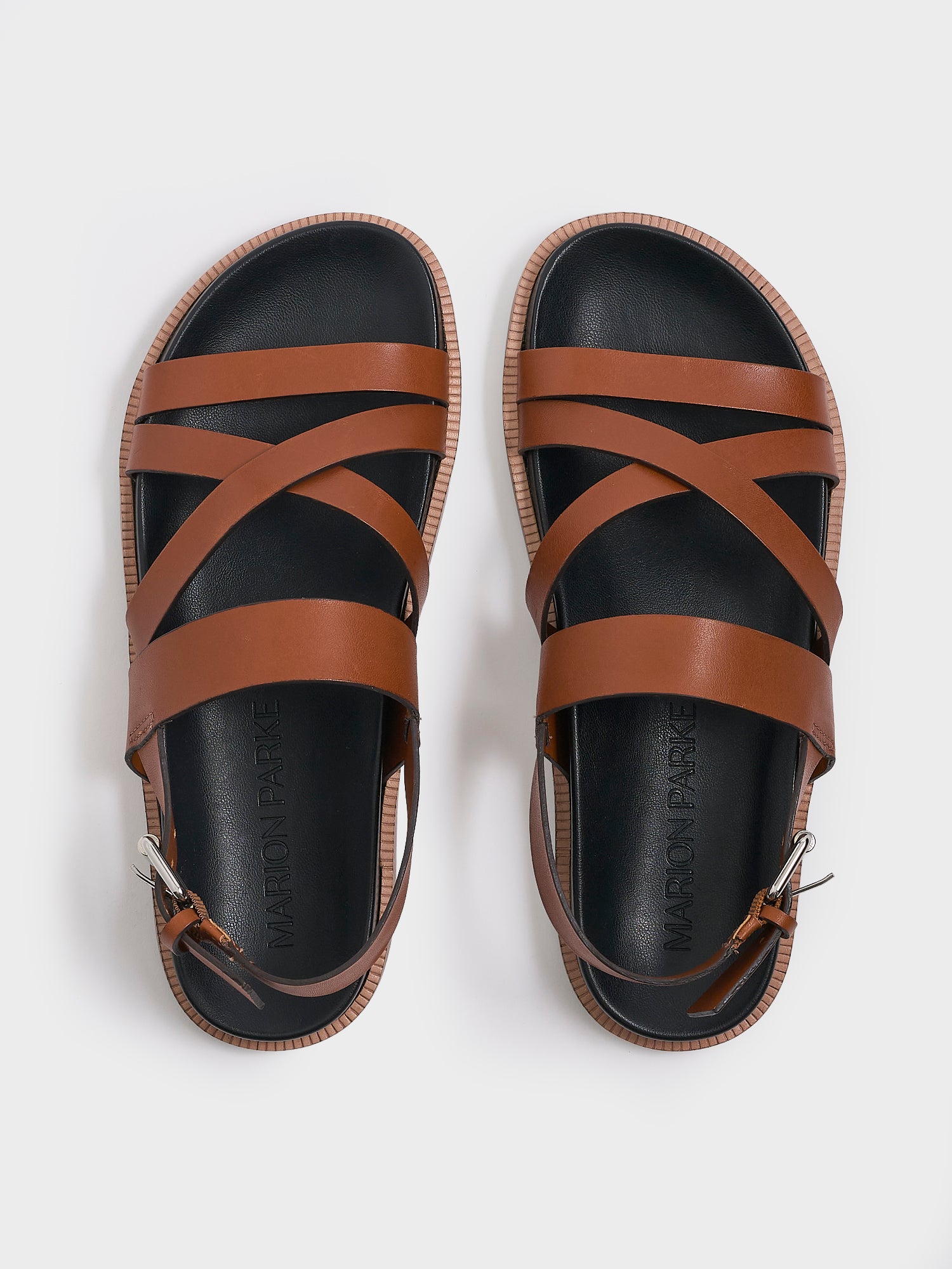 Top view of a pair of chestnut leather molded footbed slide sandals with an adjustable back strap.