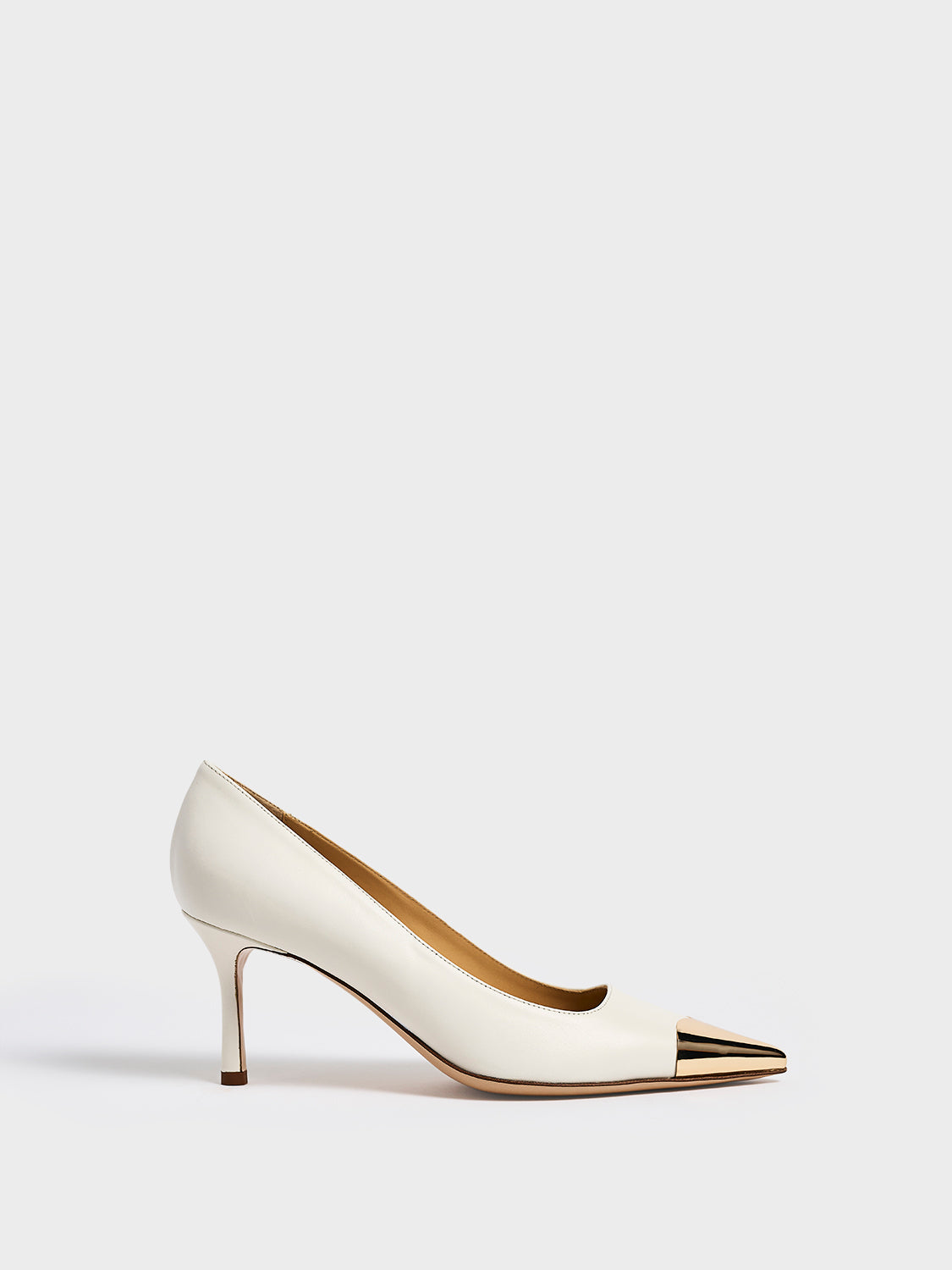 Profile view of a white leather stiletto heel pump with a gold metallic toe cap and a pointed toe.