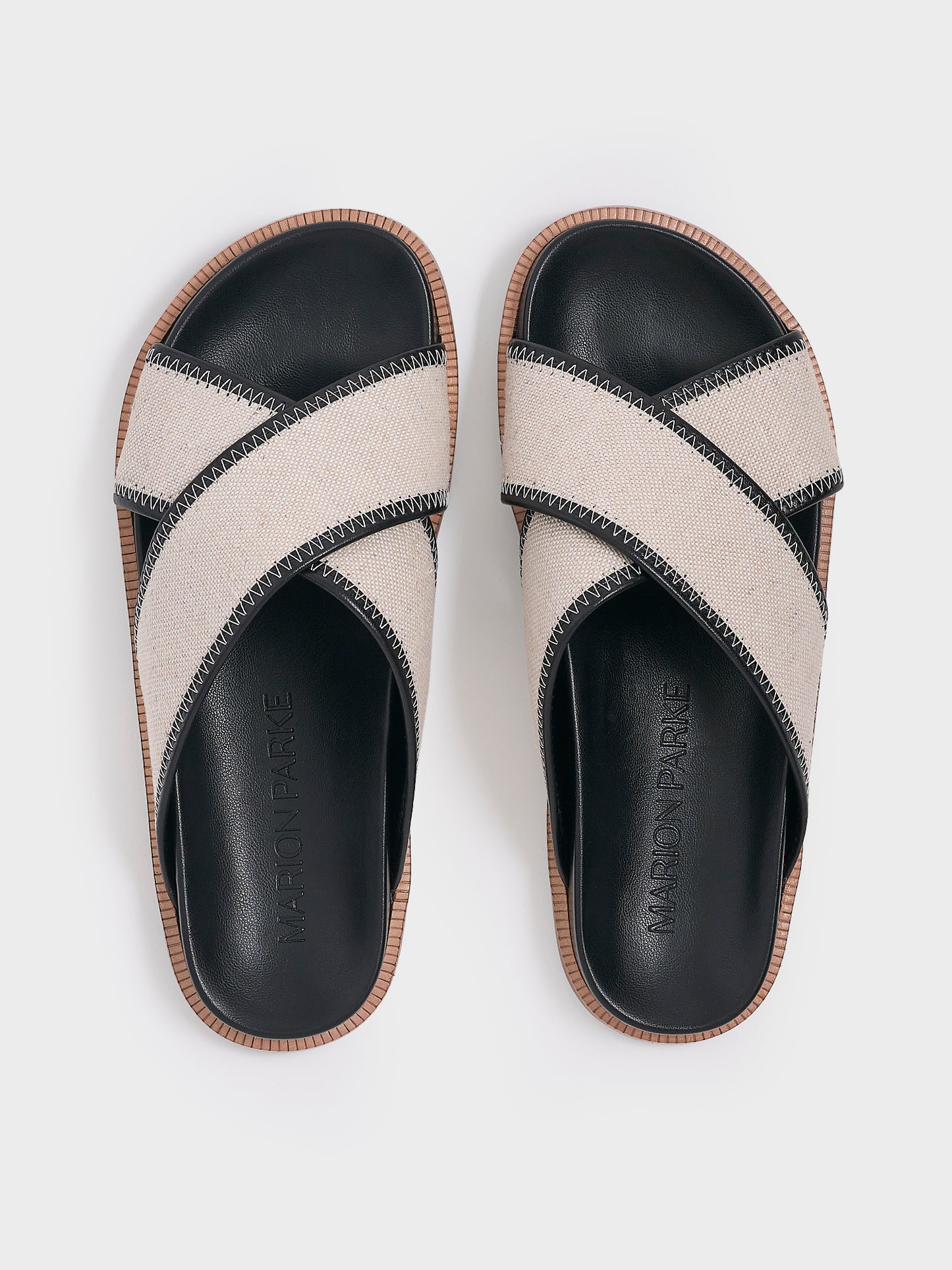Top view of a pair of salt and pepper linen molded footbed slide sandals.