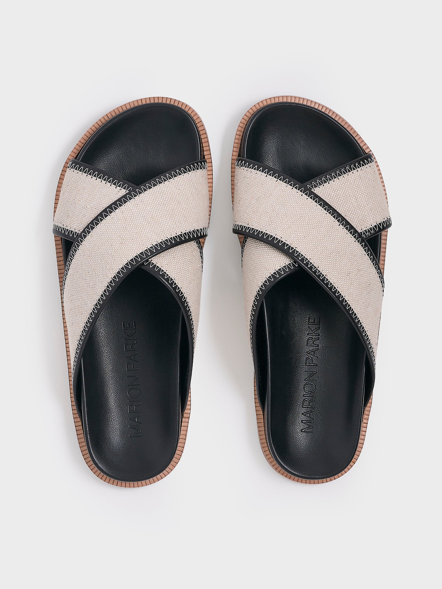 Top view of a pair of salt and pepper linen molded footbed slide sandals.