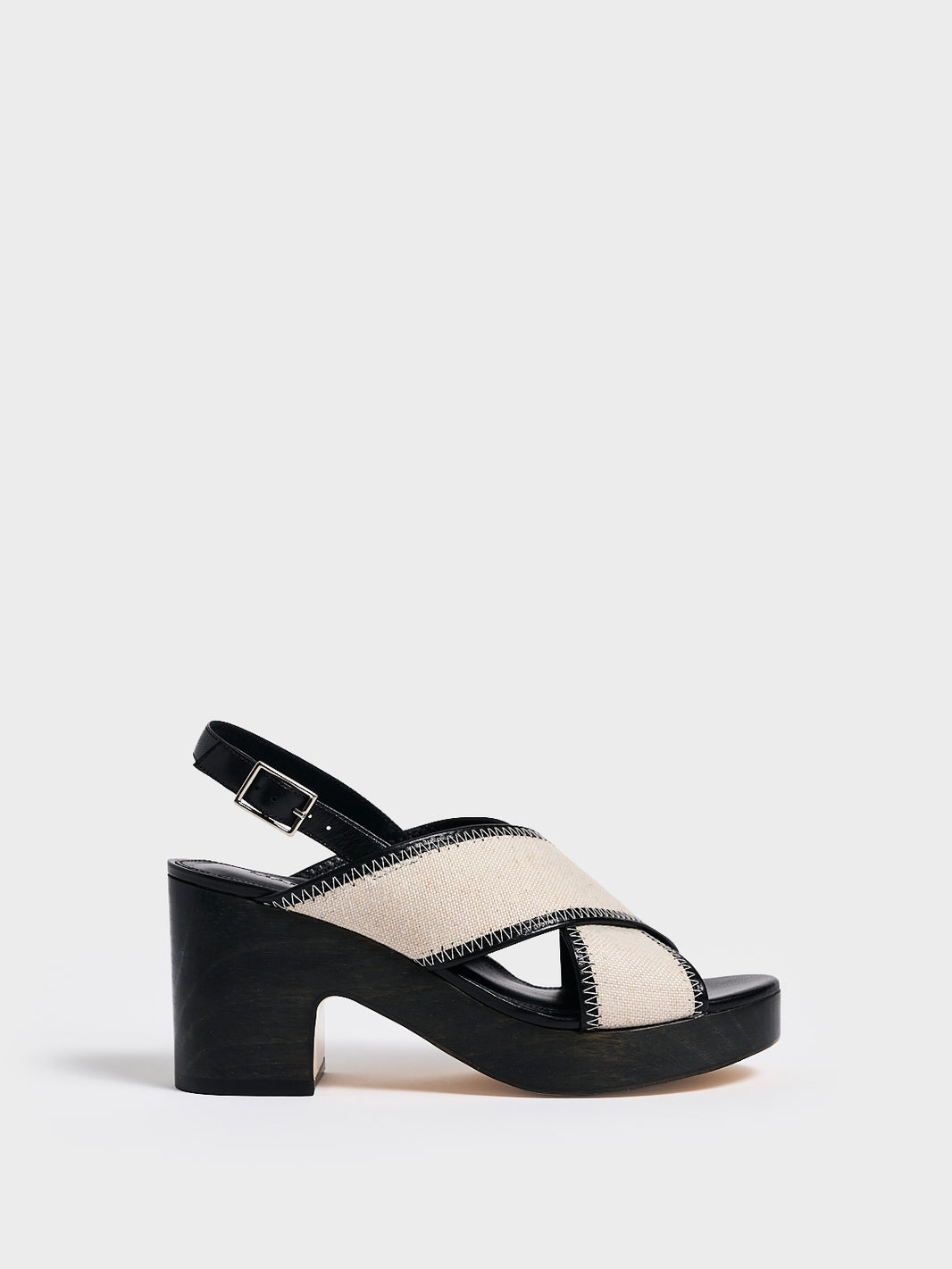 Profile view of a salt and pepper linen platform sandal with an adjustable back strap.