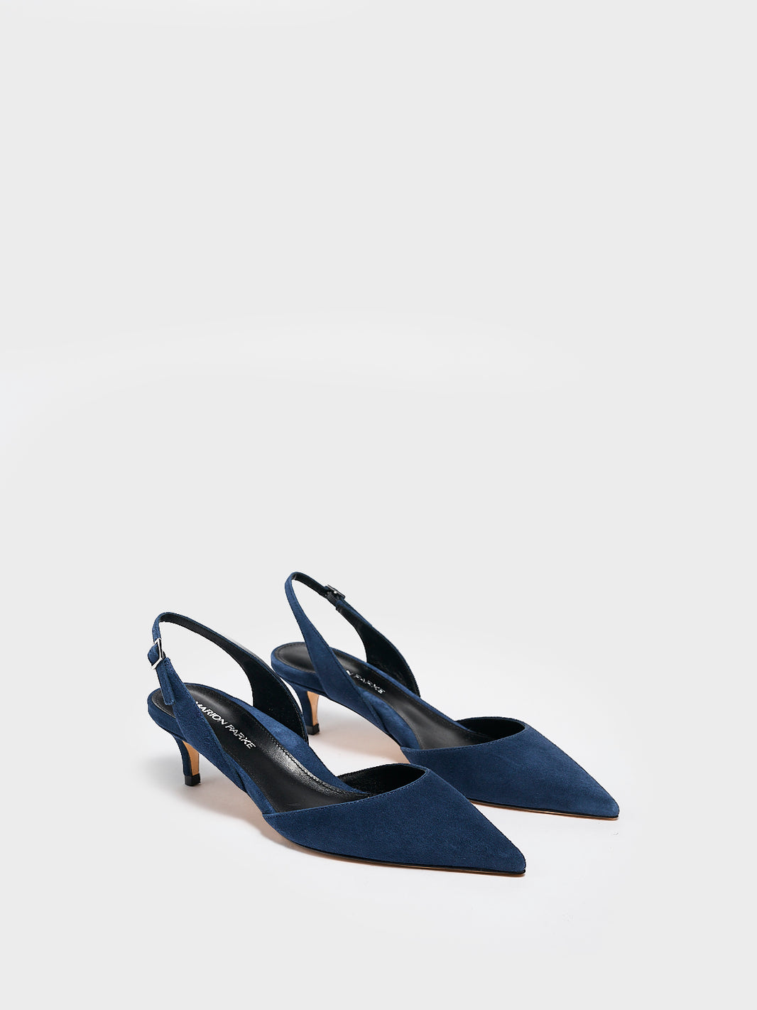 Angle view of a pair of navy blue suede kitten heel slingback with a pointed toe.