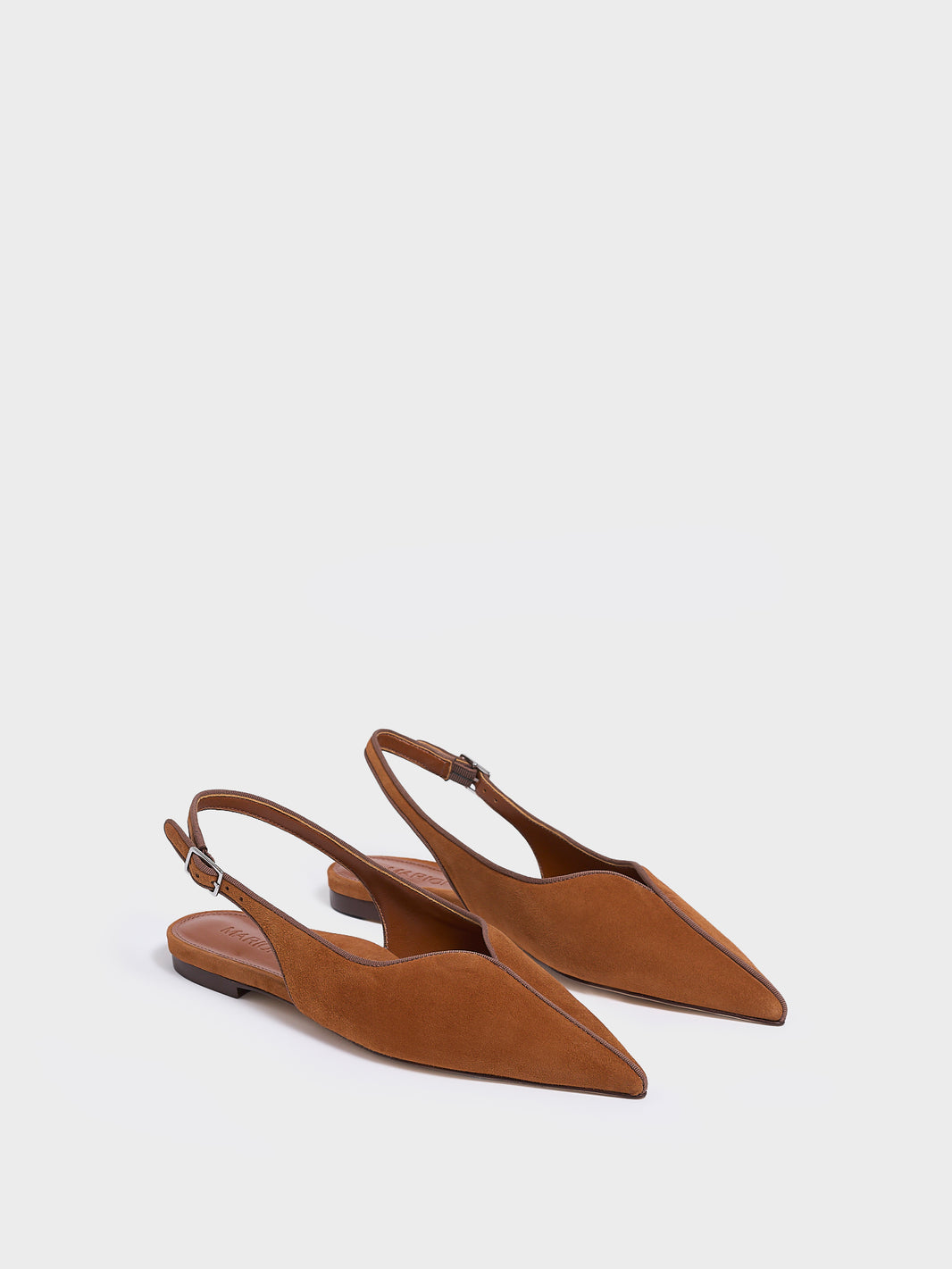 Angle view of a pair of chestnut suede slingback flats with a grosgrain trim detail.
