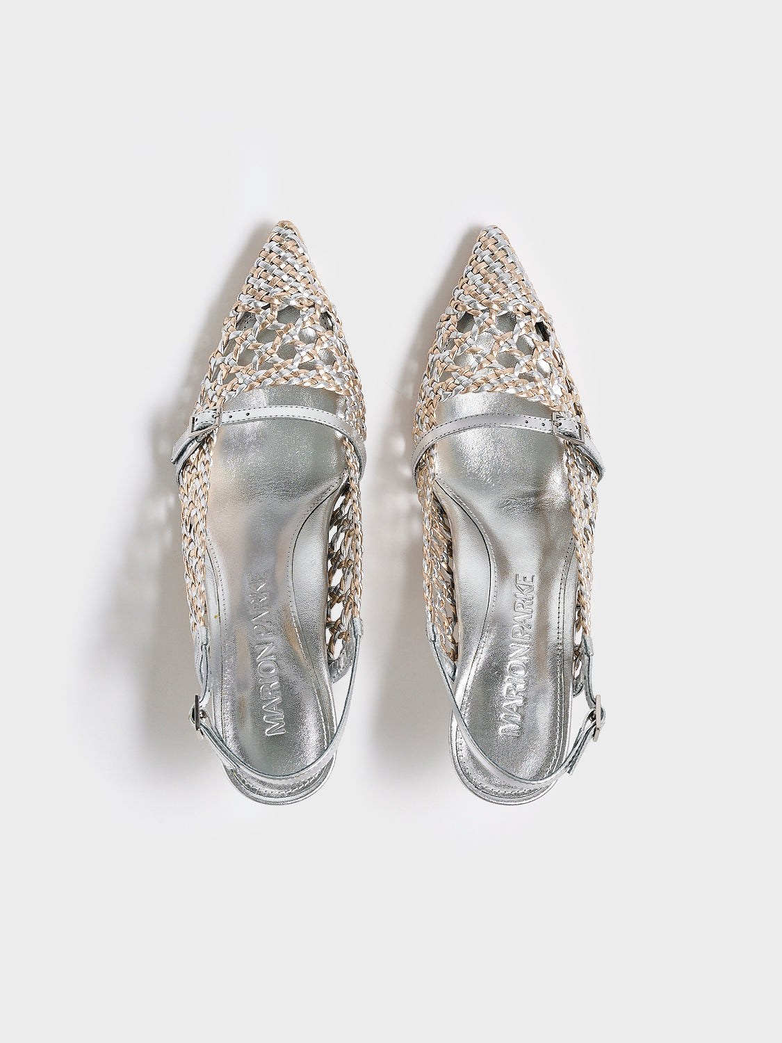 Top view of a pair of silver and gold metallic braided leather kitten heel with a slingback detail.